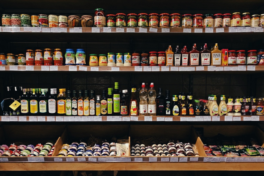 Shelves of jars with sauces and spices